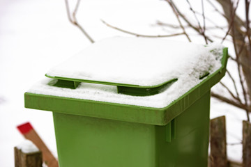 Trash bin with snow