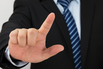 businessman hand pushing screen