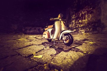 Old scooter in dark alley