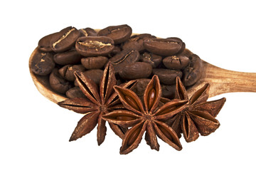 Anise and coffee beans in wooden spoon on white background
