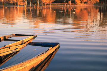 Fototapeta premium Old wooden fishing boat on a lake