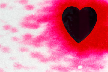 Pink color drops and splatters on black heart.