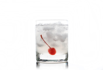 Old fashioned cocktail with cherry
