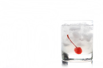Old fashioned cocktail with cherry