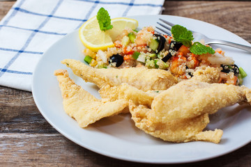 Deep fried fillet with salad