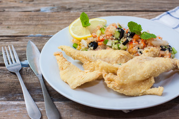 Deep fried fillet with salad