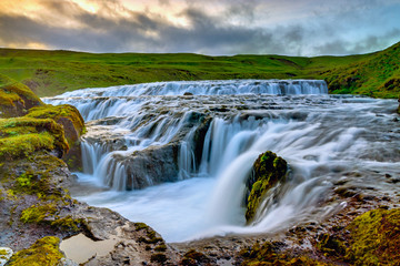 Waterfall at the Skoga upstream from Skogafoss in Iceland © elxeneize