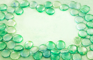 Green glass drops aqua background