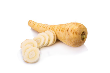 Fresh parsnip roots on a white background