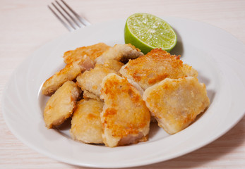 fried pieces of fish fillets