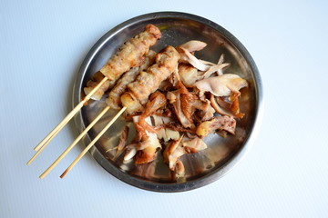 Shred Fried Chicken and Pork skewers in dish