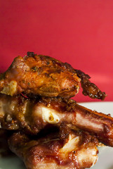 Roasted pork ribs on a white plate