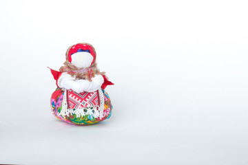 Doll amulet on a white background