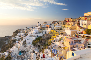 Oia village on Santorini island at sunset, Cyclades, Greece