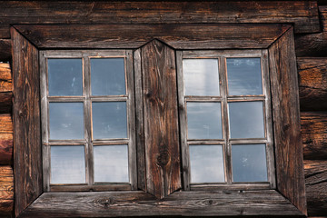 two windows of a log house