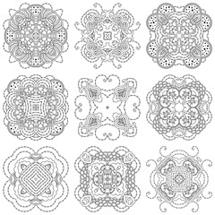 Set of nine black and white mandalas on a white background.