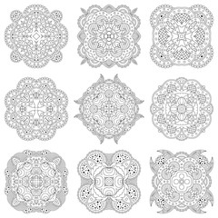 Set of nine black and white mandalas on a white background.