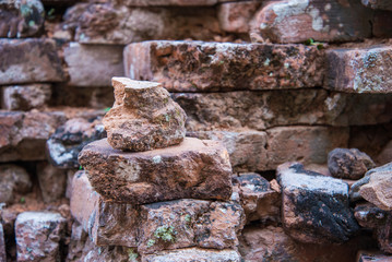 Old and broken red stone brick wall