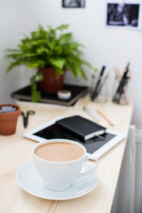 Cup of coffe in modern loft-style office