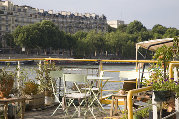Chairs and Table on Barge on River Seine, Paris, France
