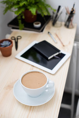 Cup of coffe in modern loft-style office