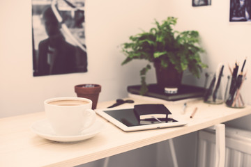 Cup of coffe in modern loft-style office