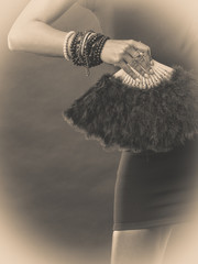 woman evening dress with black fan in hand