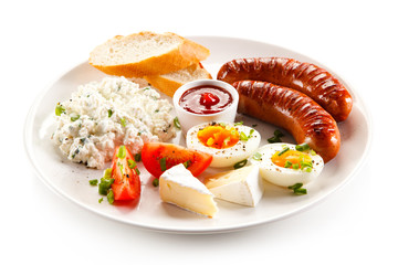 Breakfast - boiled egg, fried sausages, cottage cheese and vegetables