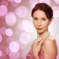 Beautiful woman with pearl beads.