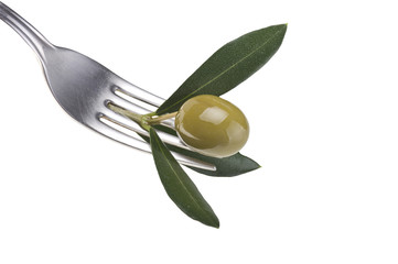 one green olive on a fork on white background