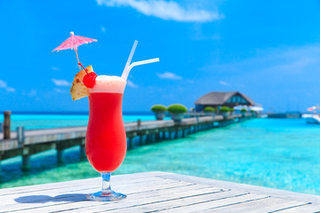 cocktail with blur beach on background