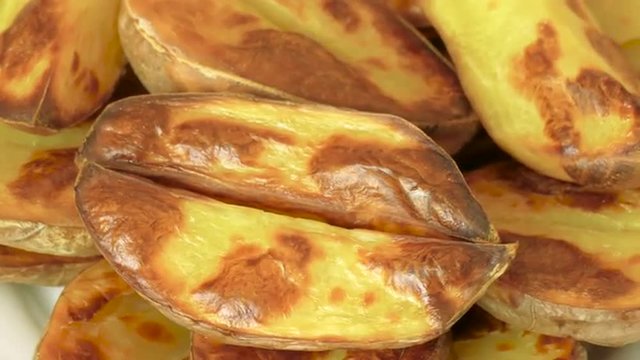 baked potato slices in the peel, closeup