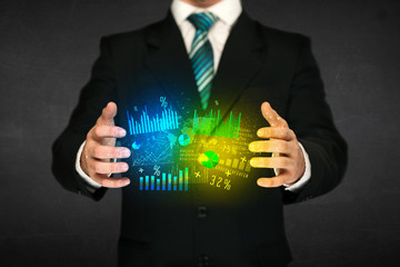 Businessman holding diagram cloud