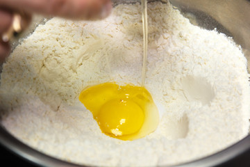 ..Preparation of the dough. Add the egg to the sifted flour.