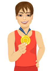 male athlete showing his gold medal