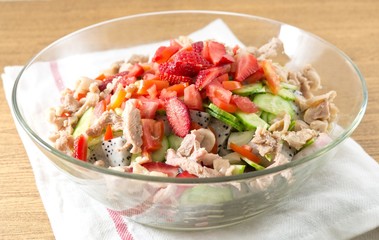 Glass Bowl of Delicious Chicken Salad with Fruits