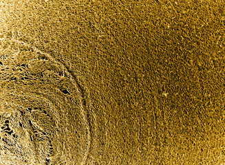 Bronze macro world texture background. Roll of paper macro