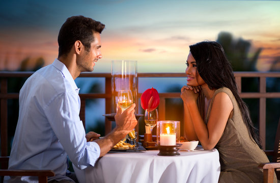 couple on summer evening having romantic dinner