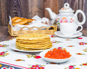 Stack of pancakes and red caviar