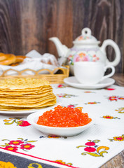Stack of pancakes and red caviar