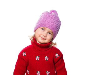 Little Funny girl in cap and red sweater.