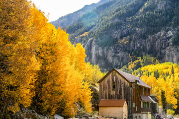 Old barn Ouray CO fall mountians leaves turning color yellow