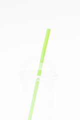 Empty plastic cup with straw isolated on white background