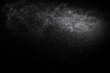 Abstract splashes and drops of water on black background.