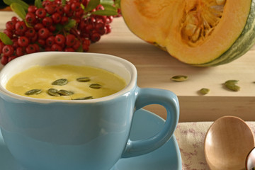 Pumpkin soup in a blue bowl