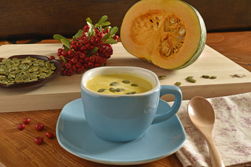 Pumpkin soup in a blue bowl