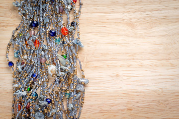 thick beaded necklace on wooden background