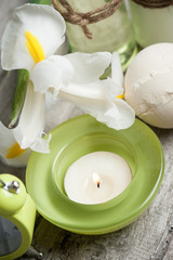Bath products, candles, wooden background