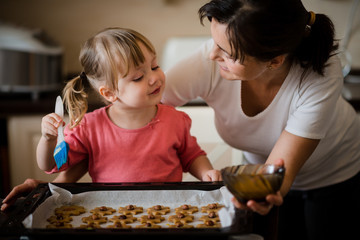 Mother and child baking together