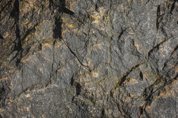 Solid rock wet surface texture.
